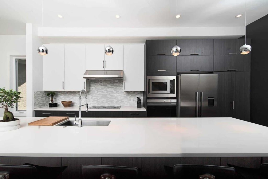 Clean white kitchen with integrated sink